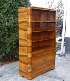 Walnut veneered art deco bookcase. Click here for more details.